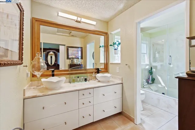 a view of a park with houses in the back