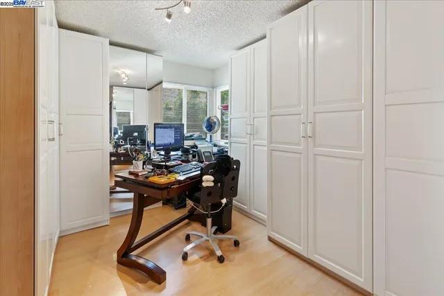 a view of a lake with houses in front of it