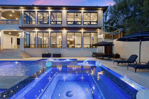 a front view of a house with swimming pool