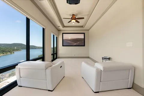 a bedroom with a large bed and a large window