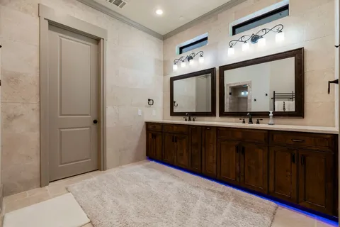 a bathroom with a granite countertop sink mirror and double