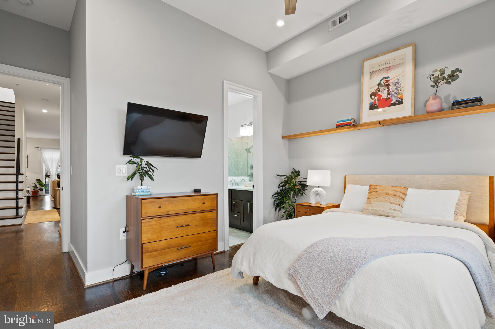913 12th Street Northeast, Unit 4 Washington, DC 20002 - Photo 14 of 33 a bedroom with a bed and flat screen tv