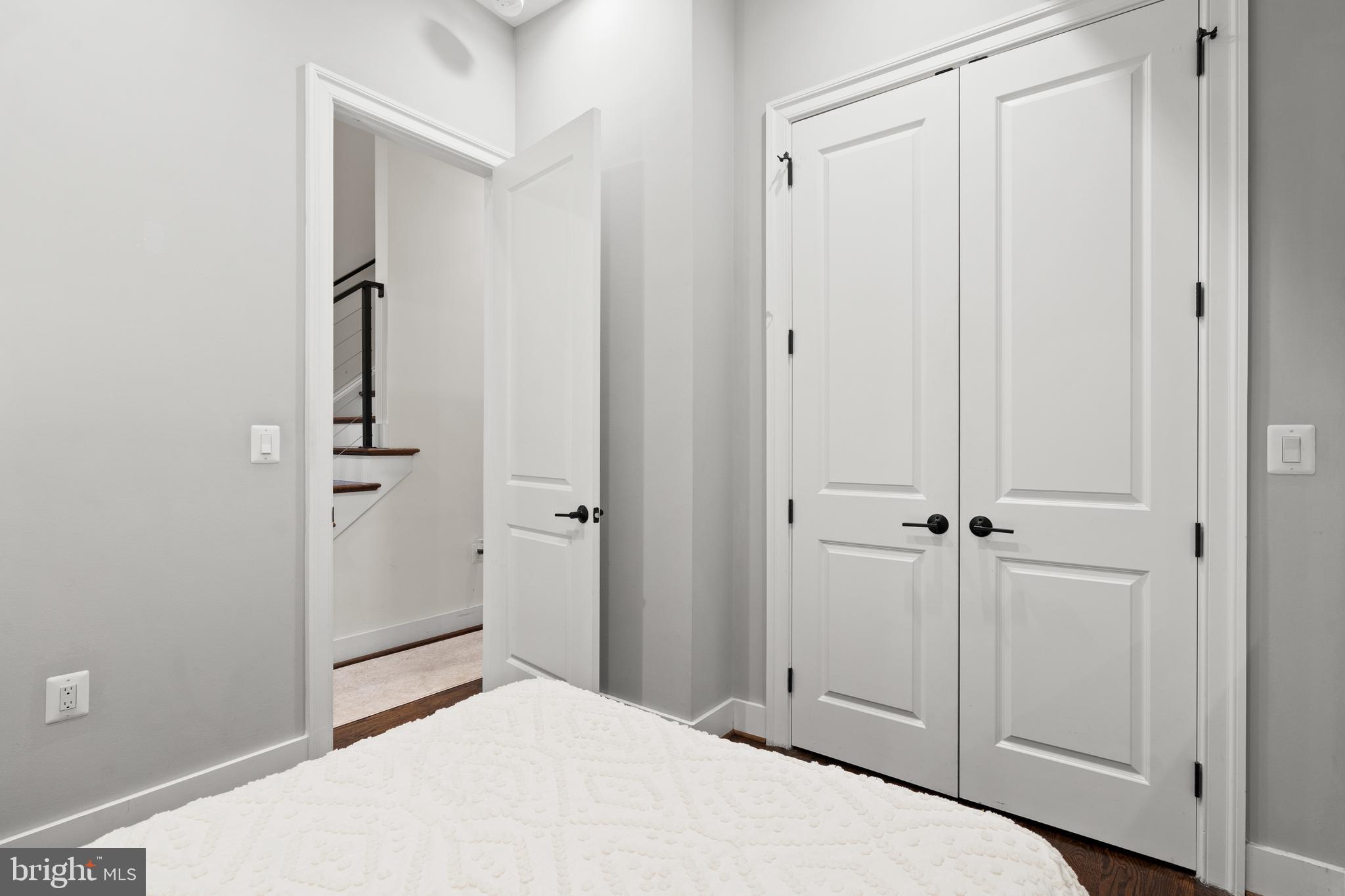 913 12th Street Northeast, Unit 4 Washington, DC 20002 - Photo 19 of 33 a bedroom with a bed and hallway