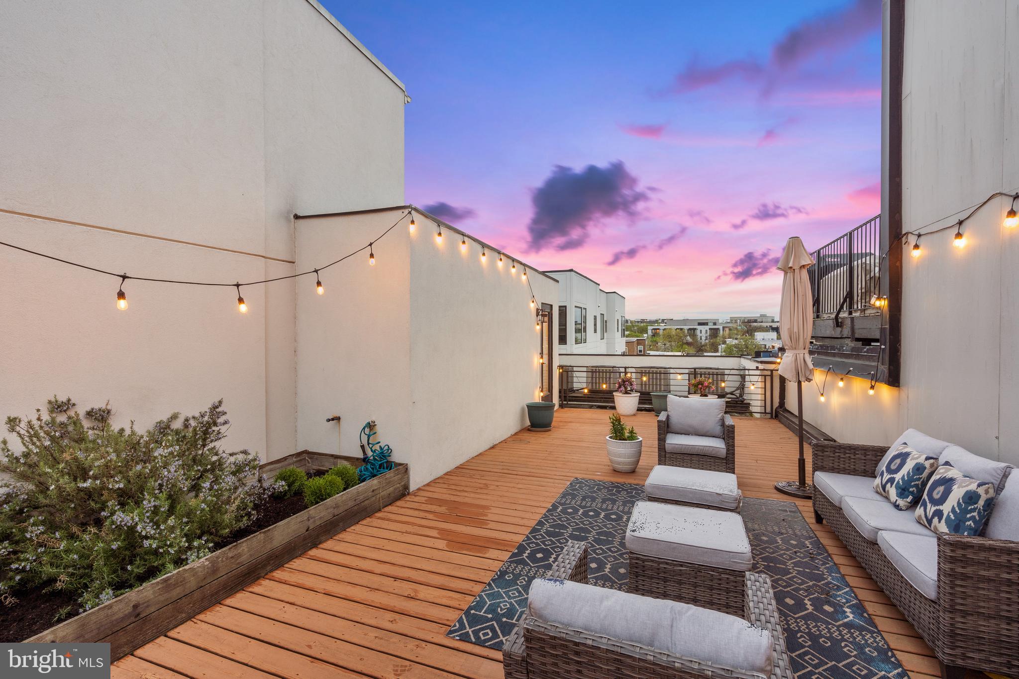 913 12th Street Northeast, Unit 4 Washington, DC 20002 - Photo 2 of 33 a view of a patio with couches and potted plants