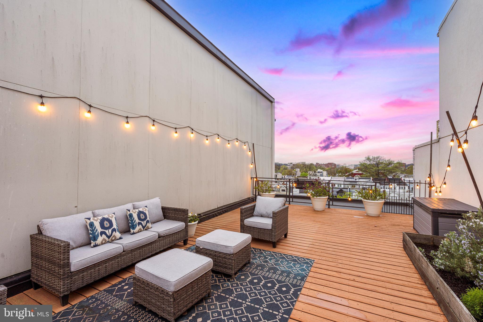 913 12th Street Northeast, Unit 4 Washington, DC 20002 - Photo 24 of 33 a balcony with wooden benches and a couch