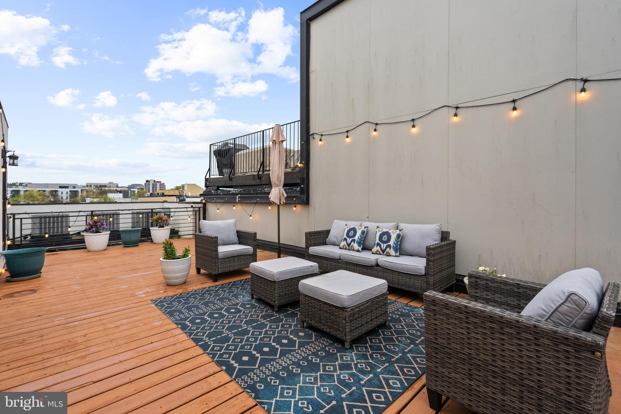 913 12th Street Northeast, Unit 4 Washington, DC 20002 - Photo 25 of 33 a outdoor space with patio couches and a potted plant