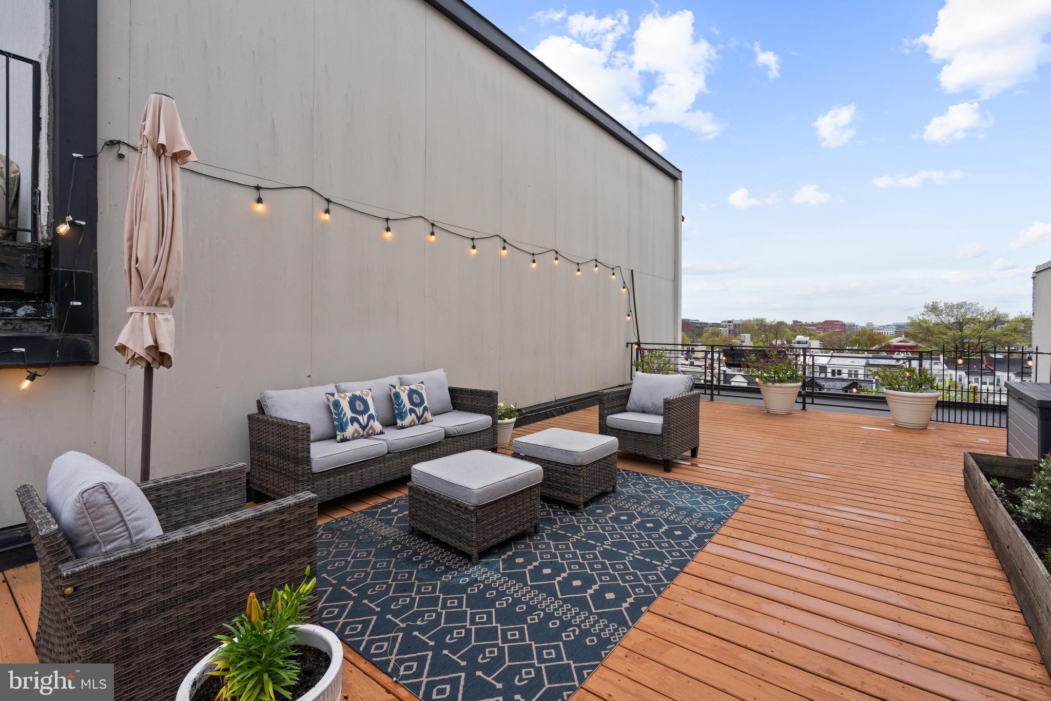 913 12th Street Northeast, Unit 4 Washington, DC 20002 - Photo 28 of 33 a outdoor living room with patio furniture and a rug