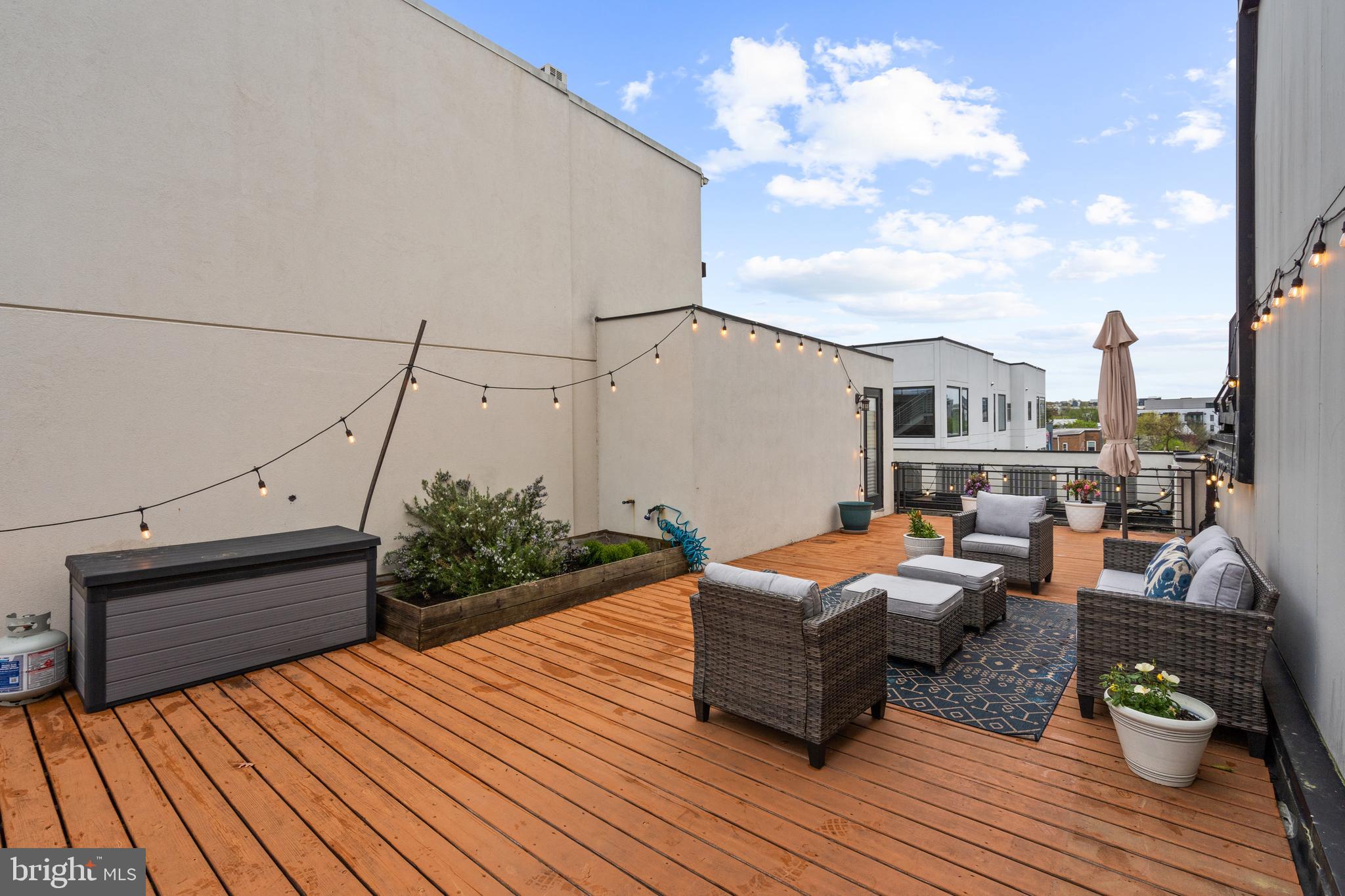 913 12th Street Northeast, Unit 4 Washington, DC 20002 - Photo 29 of 33 a outdoor sitting area with furniture and wooden floor