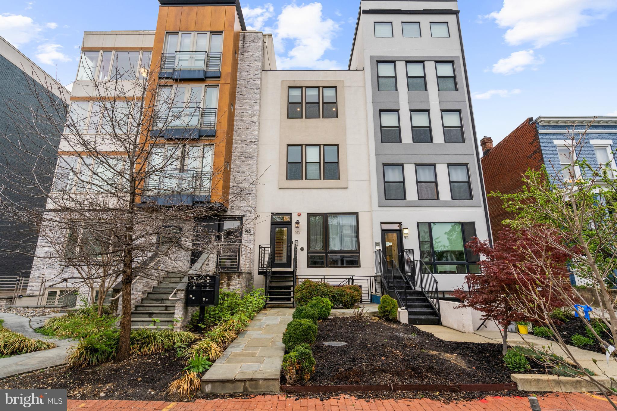 913 12th Street Northeast, Unit 4 Washington, DC 20002 - Photo 30 of 33 a view of a brick building next to a yard