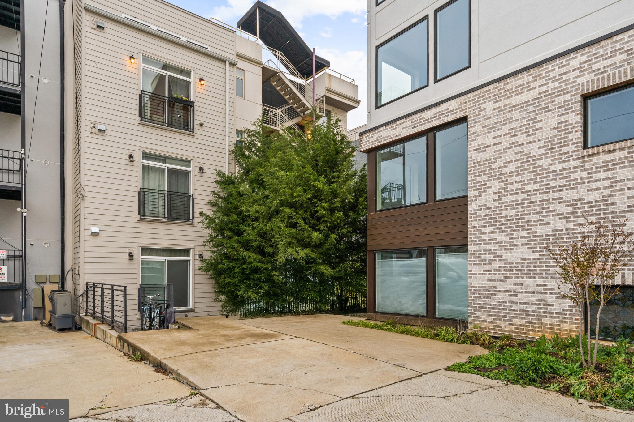 913 12th Street Northeast, Unit 4 Washington, DC 20002 - Photo 32 of 33 a front view of a house with yard