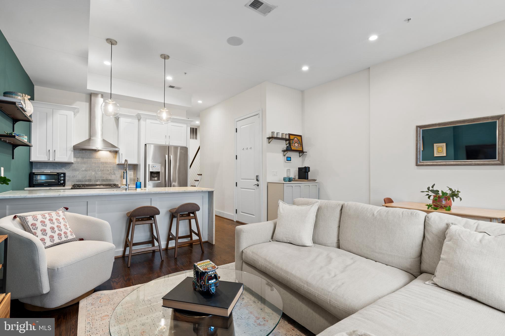 913 12th Street Northeast, Unit 4 Washington, DC 20002 - Photo 4 of 33 a living room with furniture and a flat screen tv