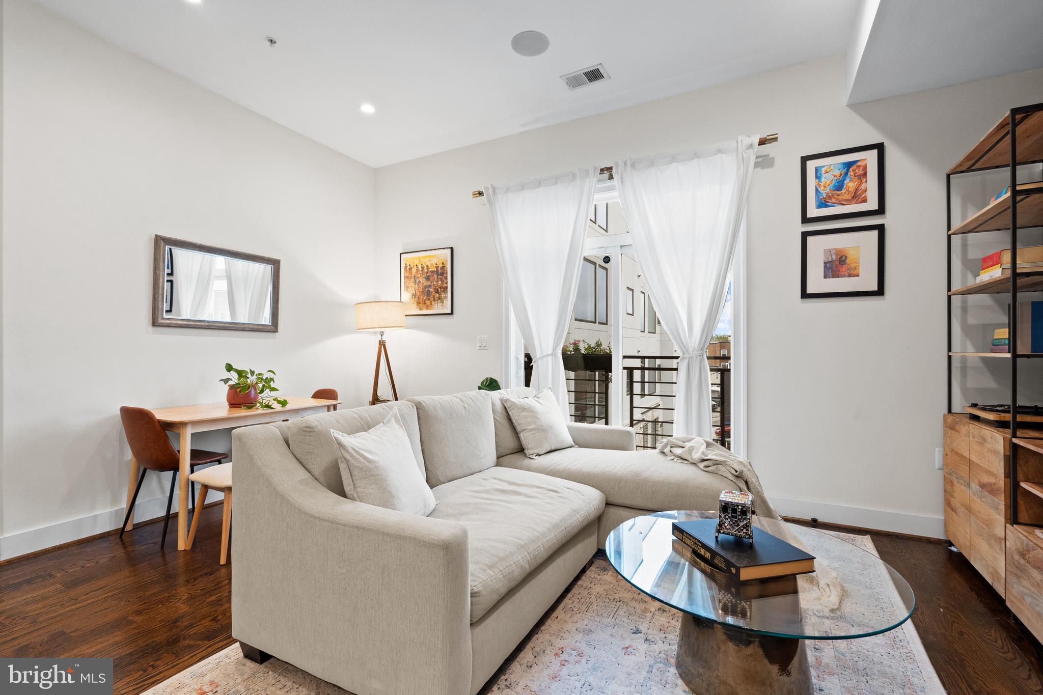 913 12th Street Northeast, Unit 4 Washington, DC 20002 - Photo 6 of 33 a living room with furniture and wooden floor