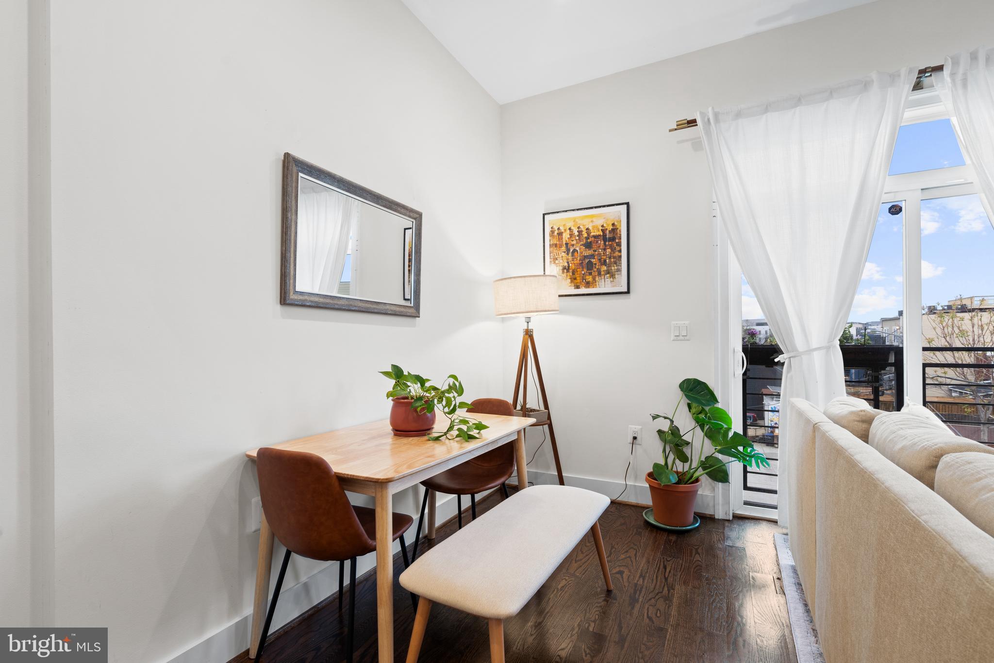 913 12th Street Northeast, Unit 4 Washington, DC 20002 - Photo 7 of 33 a view of a dining room with furniture and wooden floor