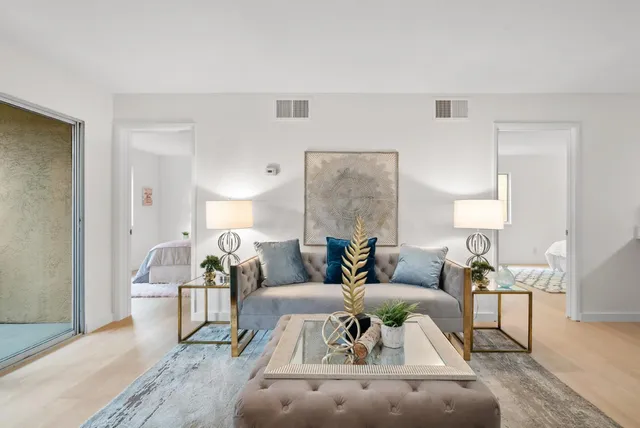 a living room with furniture and a large window