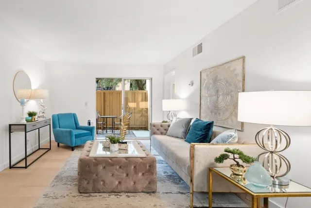 a living room with furniture and a table