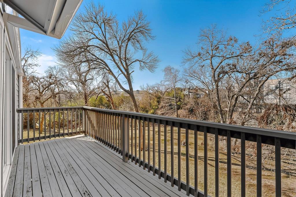 9222 Church Road, Unit 112 Dallas, TX 75231 - Photo 15 of 22 a view of a balcony with wooden floor