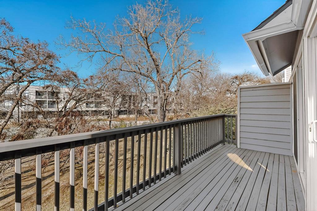 9222 Church Road, Unit 112 Dallas, TX 75231 - Photo 16 of 22 a view of a balcony with wooden floor