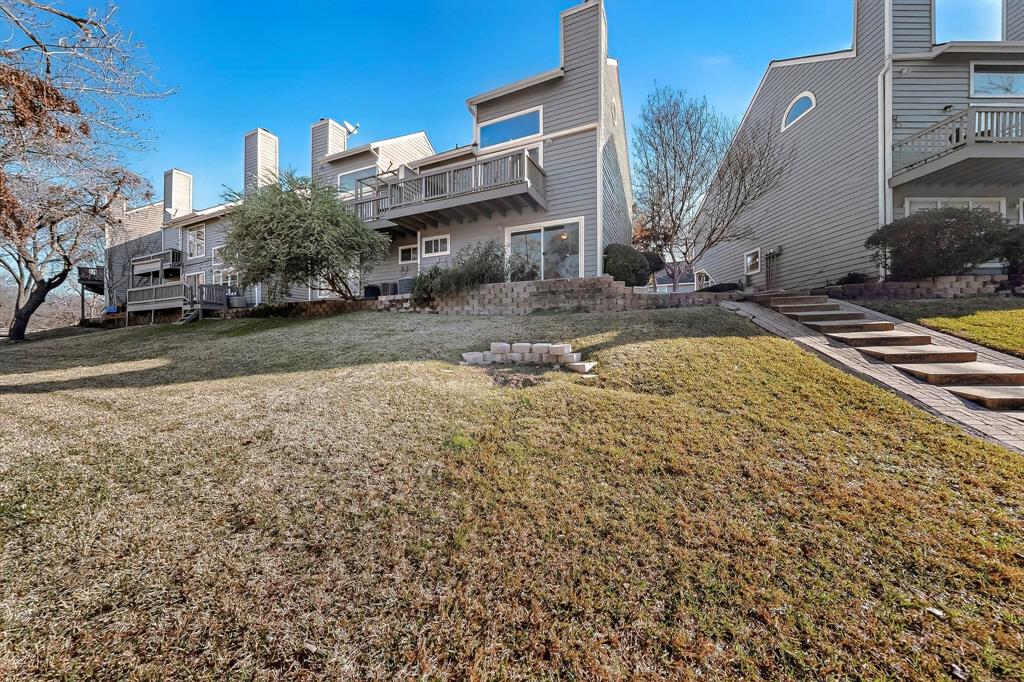 9222 Church Road, Unit 112 Dallas, TX 75231 - Photo 17 of 22 a view of a house with a yard
