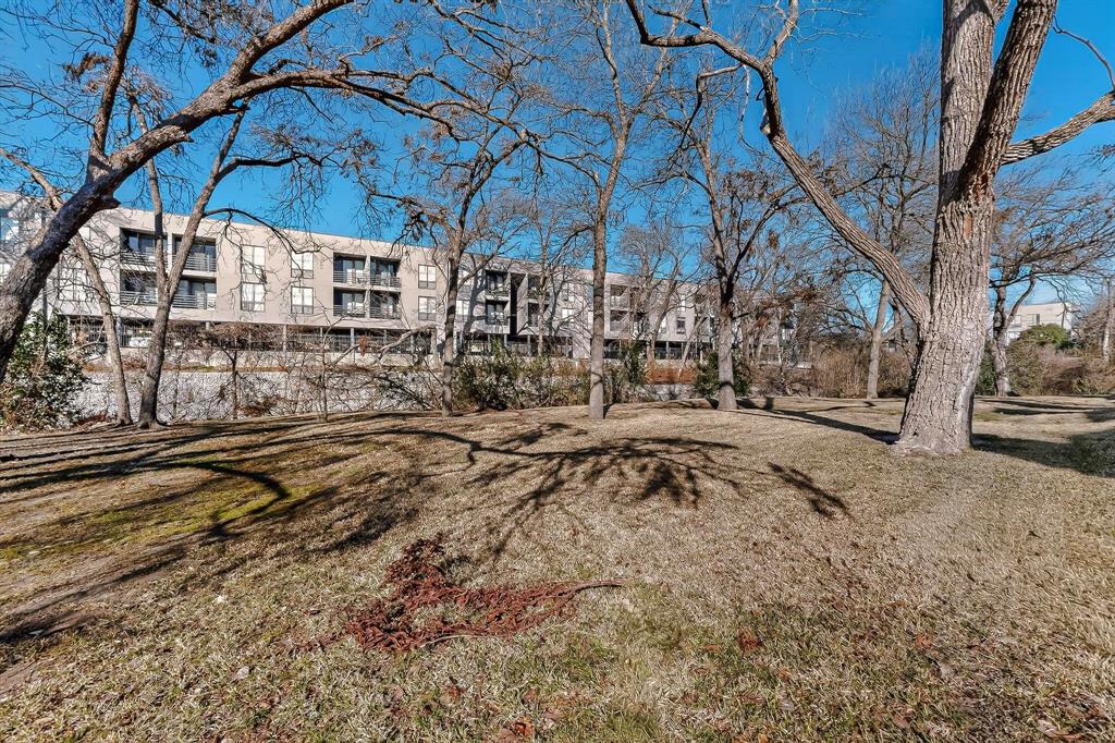 9222 Church Road, Unit 112 Dallas, TX 75231 - Photo 18 of 22 a view of yard with wooden fence