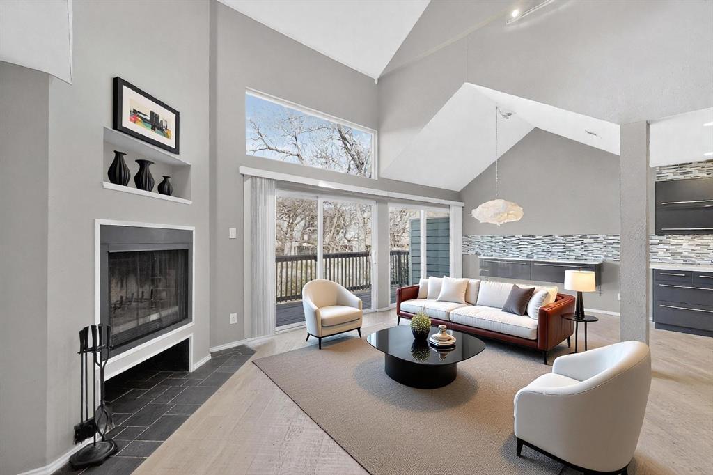 9222 Church Road, Unit 112 Dallas, TX 75231 - Photo 4 of 22 a living room with furniture and a fireplace