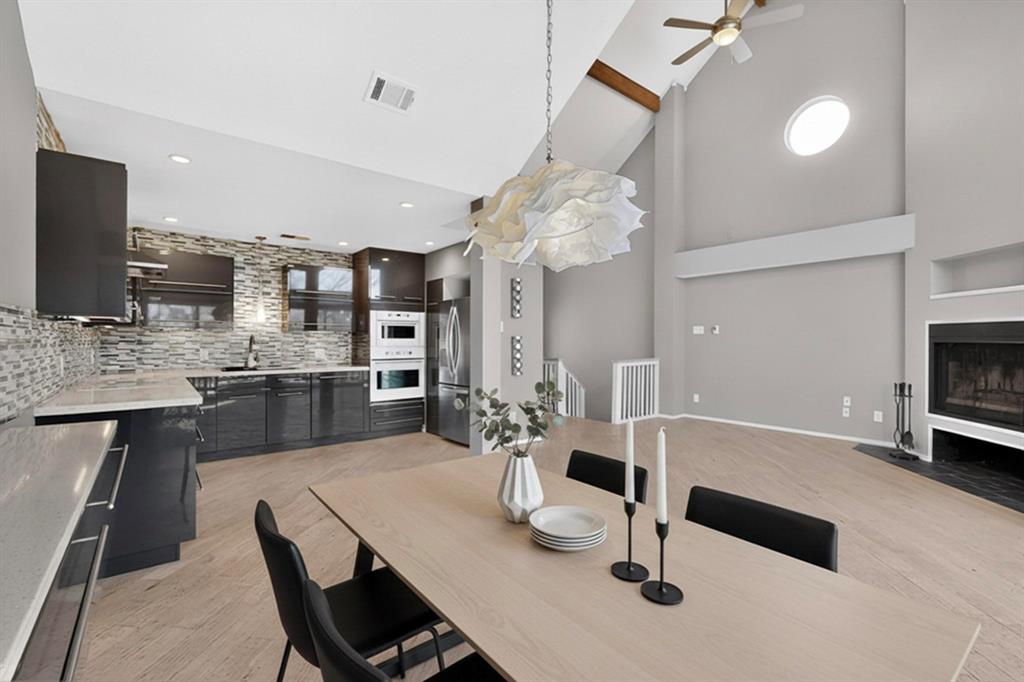 9222 Church Road, Unit 112 Dallas, TX 75231 - Photo 5 of 22 a kitchen with granite countertop a sink cabinets and stainless steel appliances