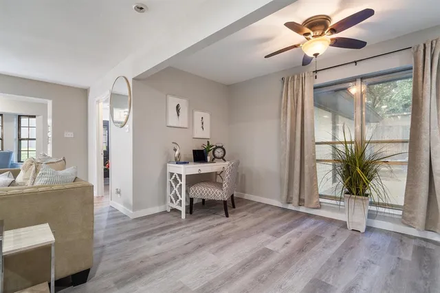 a view of a livingroom with furniture and a wooden floor