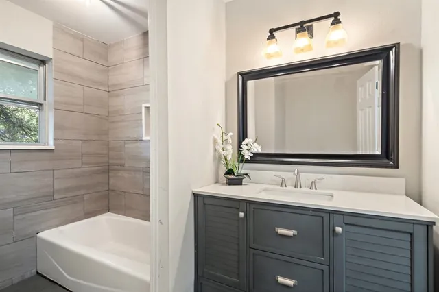 a bathroom with a sink and a mirror