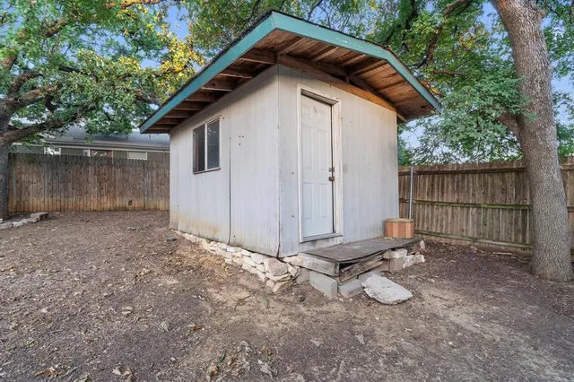 a view of a house with a yard and garage
