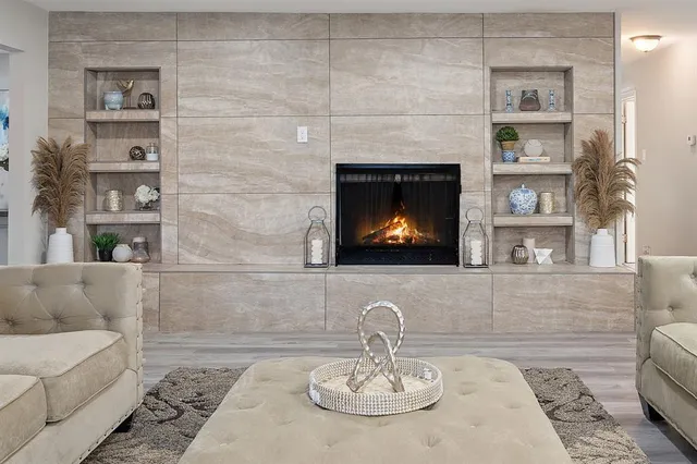 a living room with furniture and a fireplace