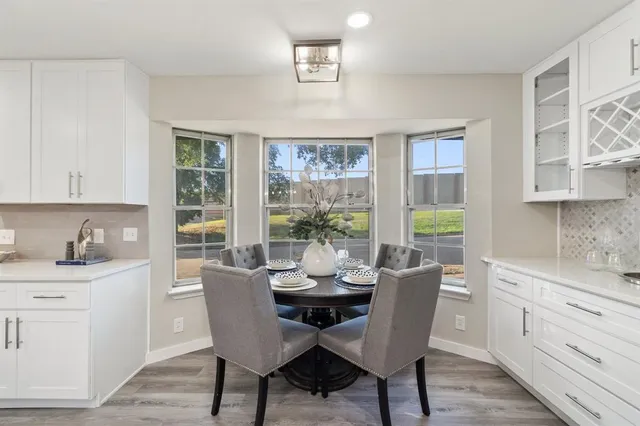 a dining room with furniture and window