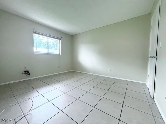 a view of an empty room and window