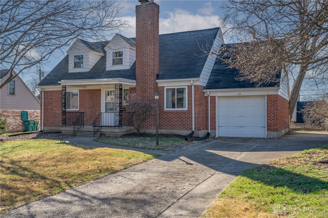 326 North Bromfield Road Kettering, OH 45429 - Photo 2 of 30 This charming brick residence offers a welcoming facade with a convenient attached garage.