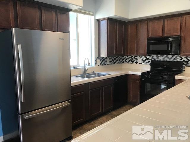 2185 Stanhope Lane Reno, NV 89502 - Photo 3 of 12 a kitchen with a refrigerator and a sink