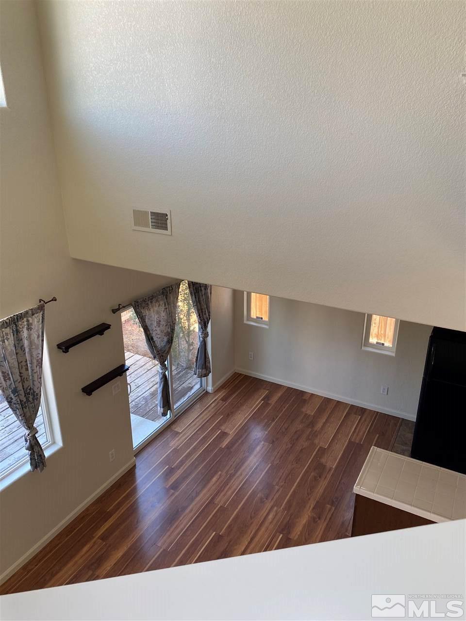2185 Stanhope Lane Reno, NV 89502 - Photo 7 of 12 a living room with furniture and a fireplace