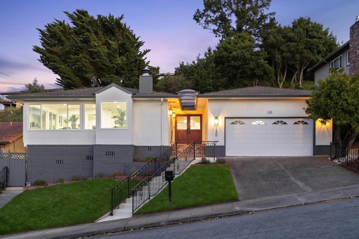 1225 Roble Road Millbrae, CA 94030 - Photo 1 of 42 a front view of a house with a yard and garage