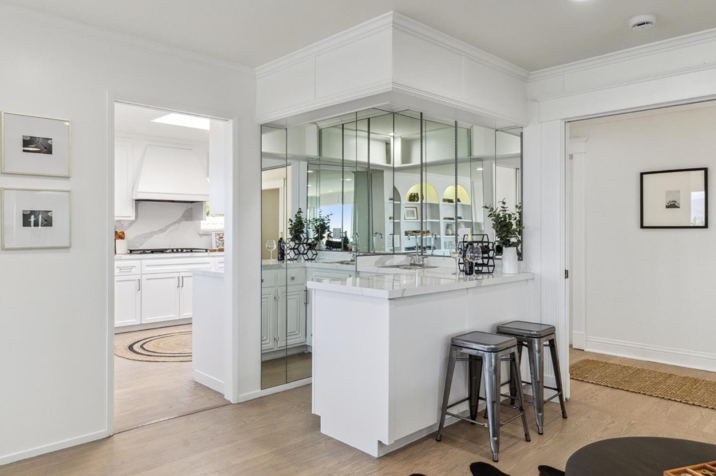 1225 Roble Road Millbrae, CA 94030 - Photo 11 of 42 a kitchen with a white cabinets and chairs