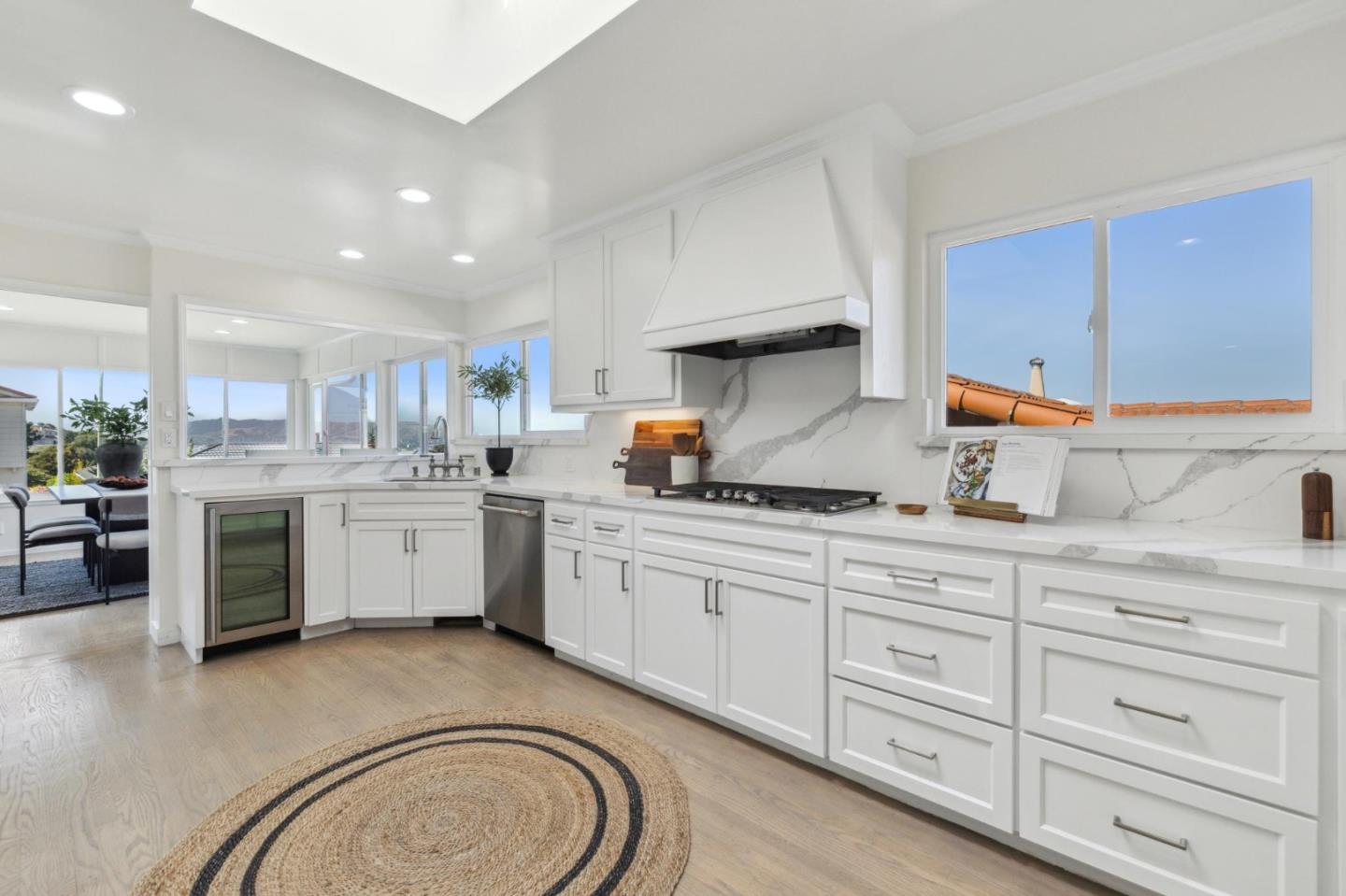 1225 Roble Road Millbrae, CA 94030 - Photo 14 of 42 a kitchen with sink cabinets and stove