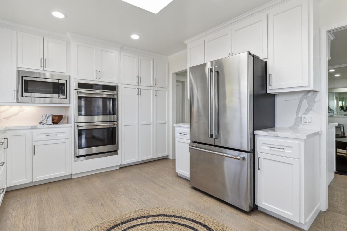 1225 Roble Road Millbrae, CA 94030 - Photo 16 of 42 a kitchen with stainless steel appliances and refrigerator