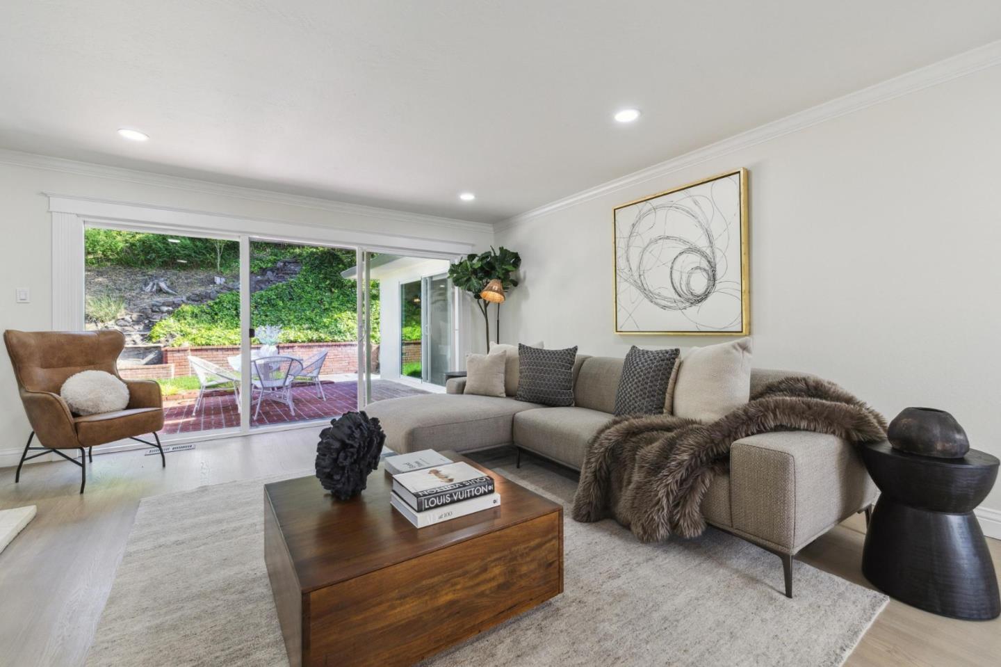 1225 Roble Road Millbrae, CA 94030 - Photo 18 of 42 a living room with furniture and a large window