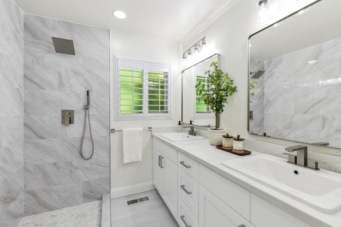 1225 Roble Road Millbrae, CA 94030 - Photo 22 of 42 a bathroom with a double vanity sink mirror and shower