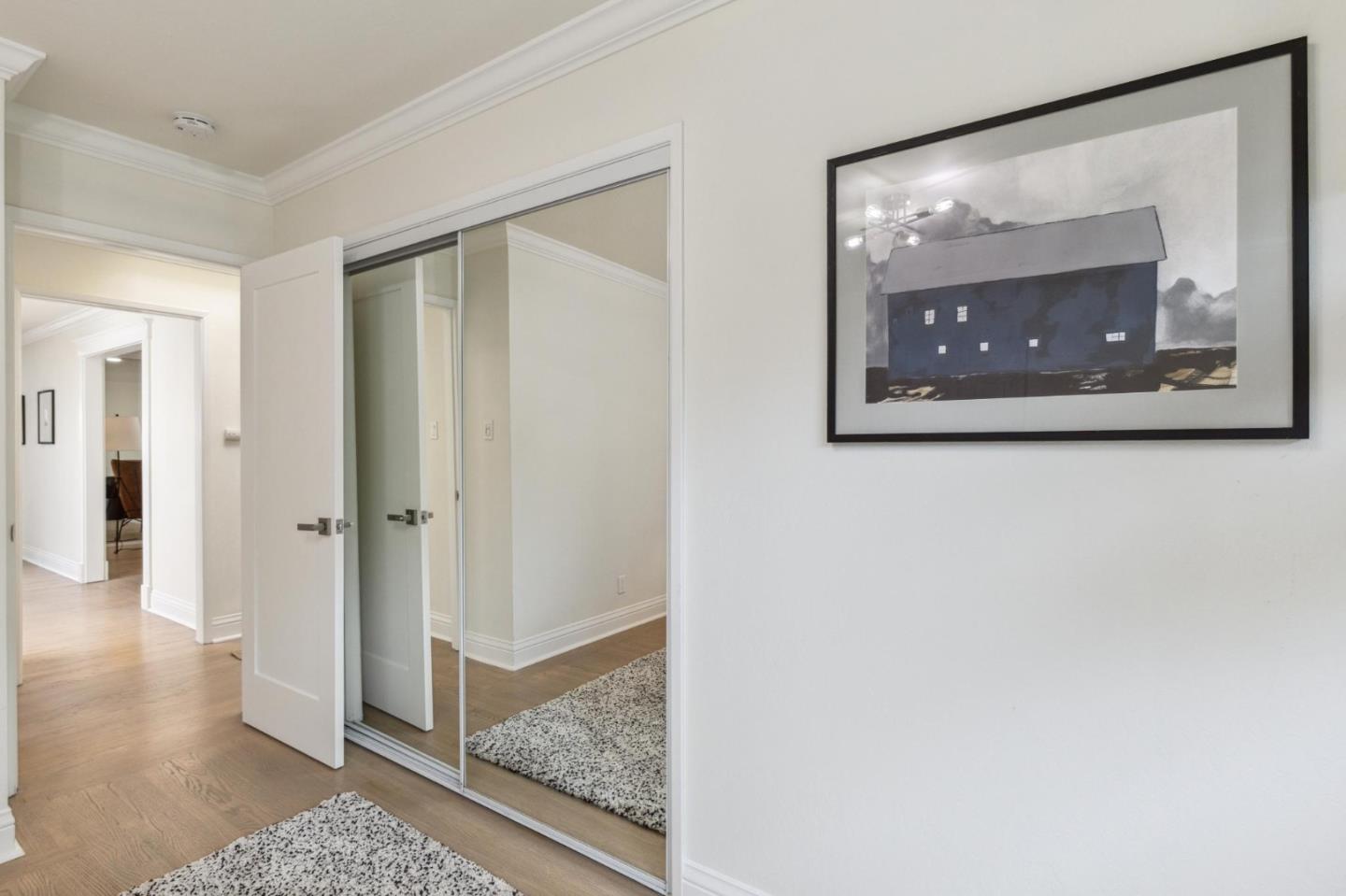 1225 Roble Road Millbrae, CA 94030 - Photo 28 of 42 a view of a hallway with wooden floor and a cabinet