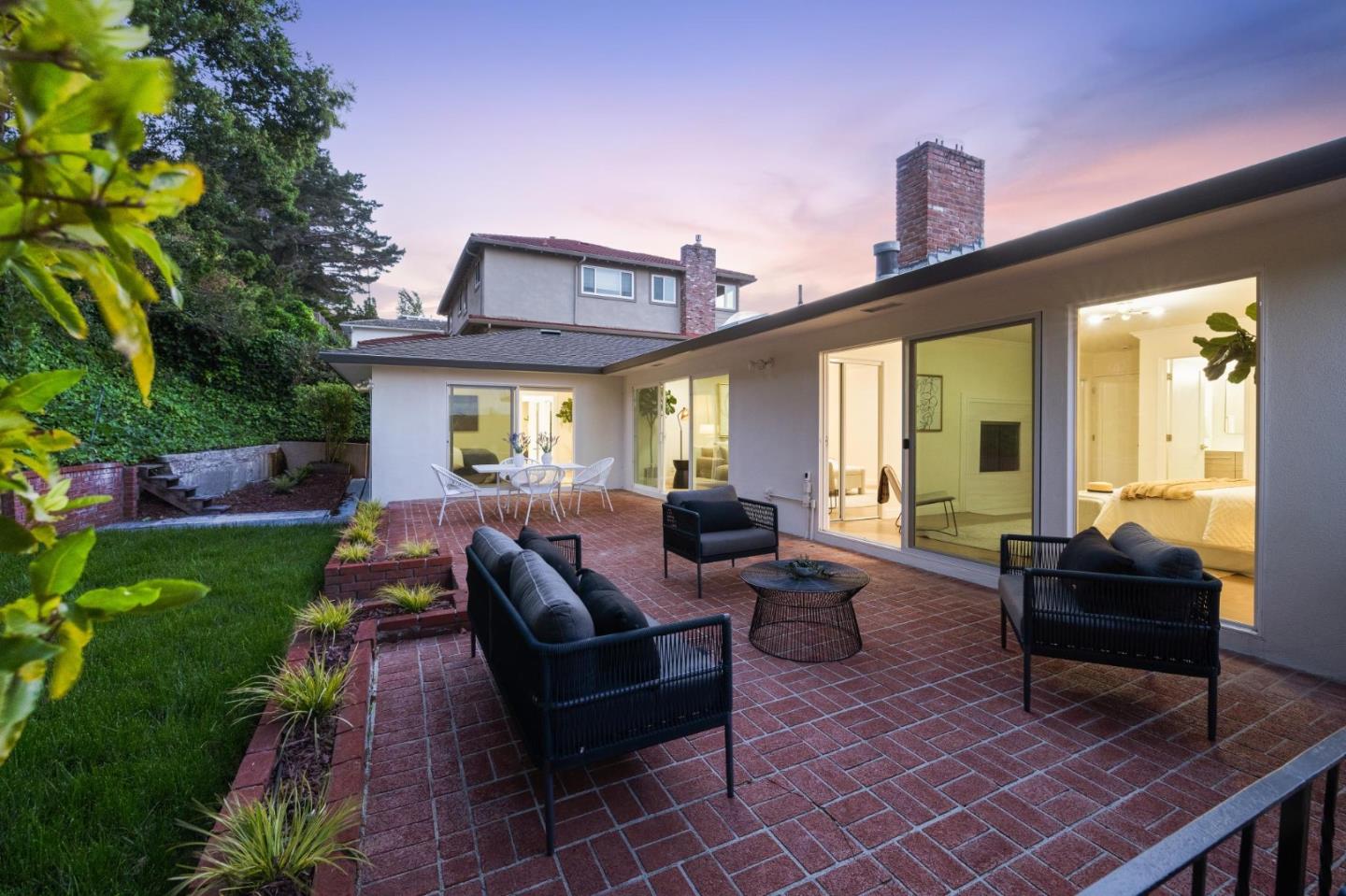 1225 Roble Road Millbrae, CA 94030 - Photo 39 of 42 a view of a patio with couches table and chairs and potted plants