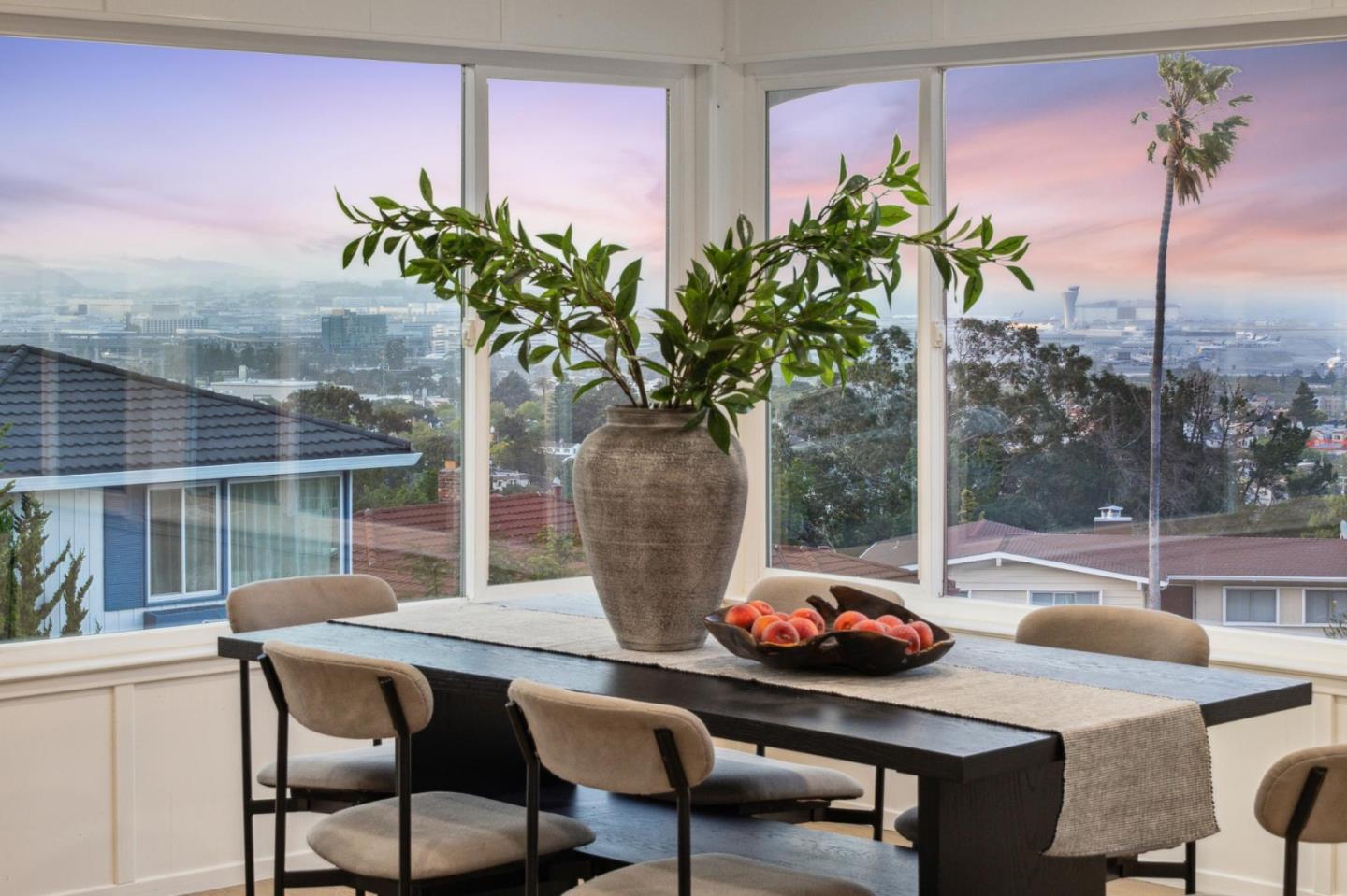 1225 Roble Road Millbrae, CA 94030 - Photo 8 of 42 a table and a vase with flowers on a table and a potted plant