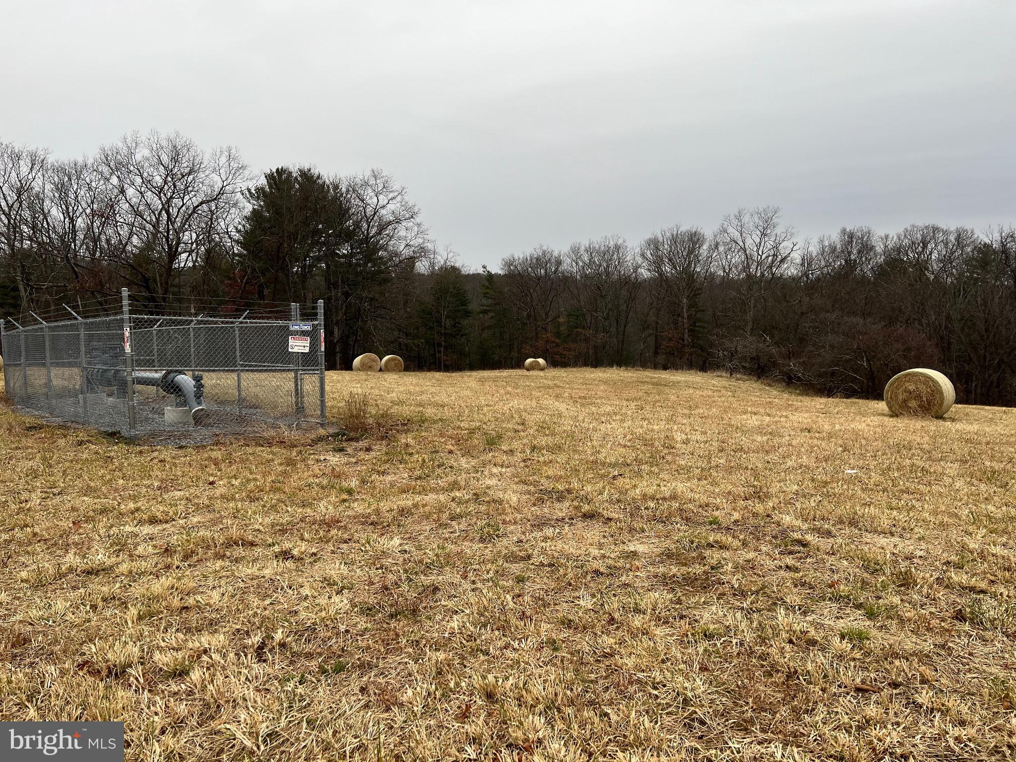 6499 Martinsburg Road Berkeley Springs, WV 25411 - Photo 4 of 5 a backyard of a house with lots of green space