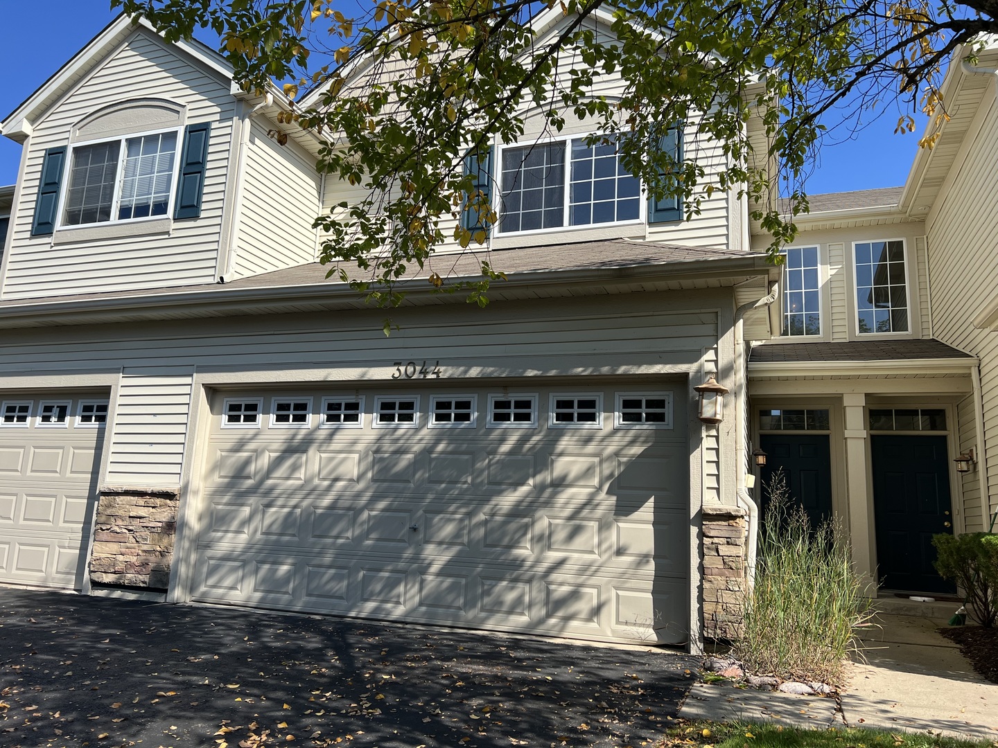 3044 Troon Drive Montgomery, IL 60538 - Photo 1 of 20 a front view of a house with a street