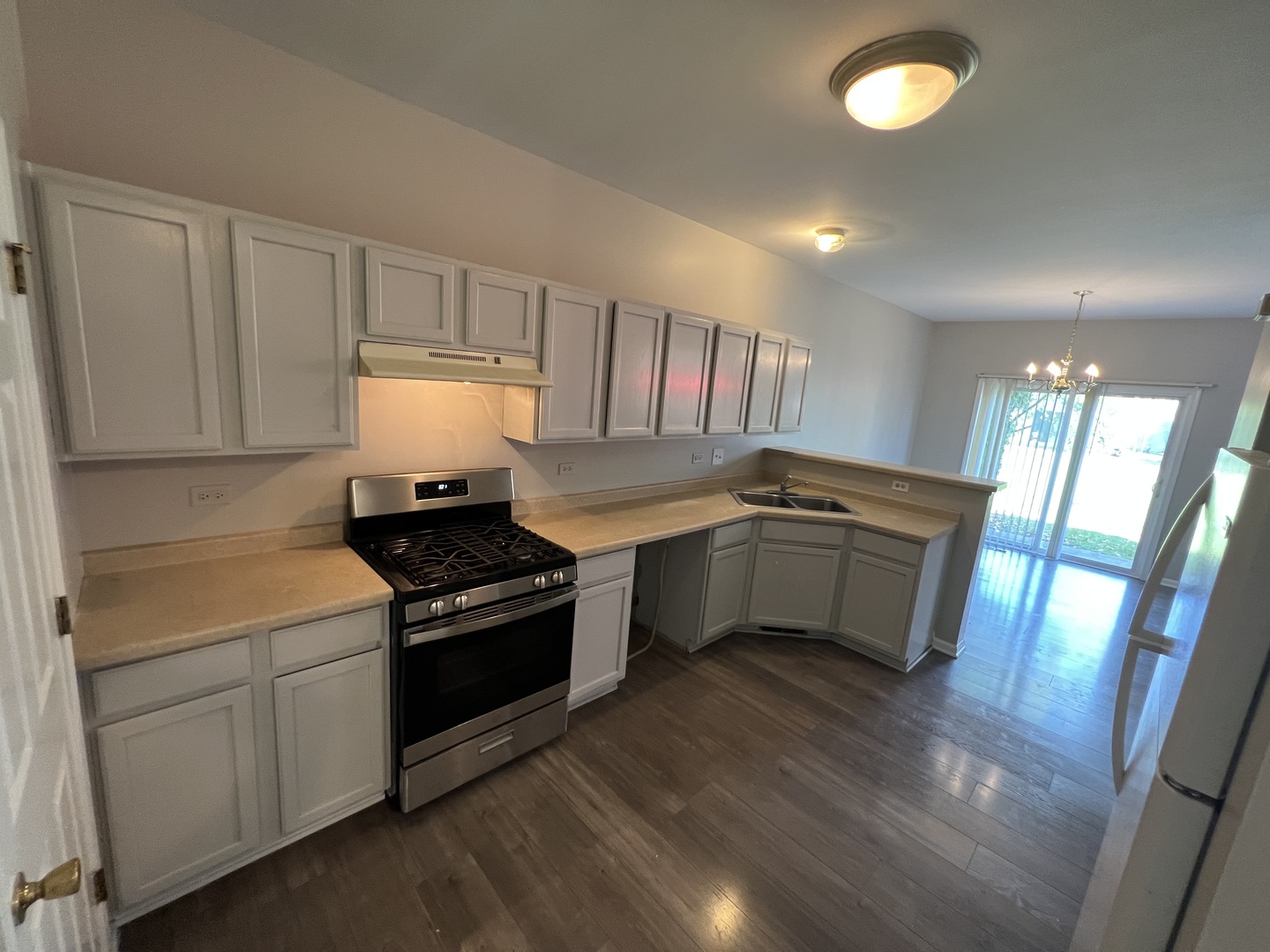3044 Troon Drive Montgomery, IL 60538 - Photo 16 of 20 a kitchen with a stove sink and cabinets