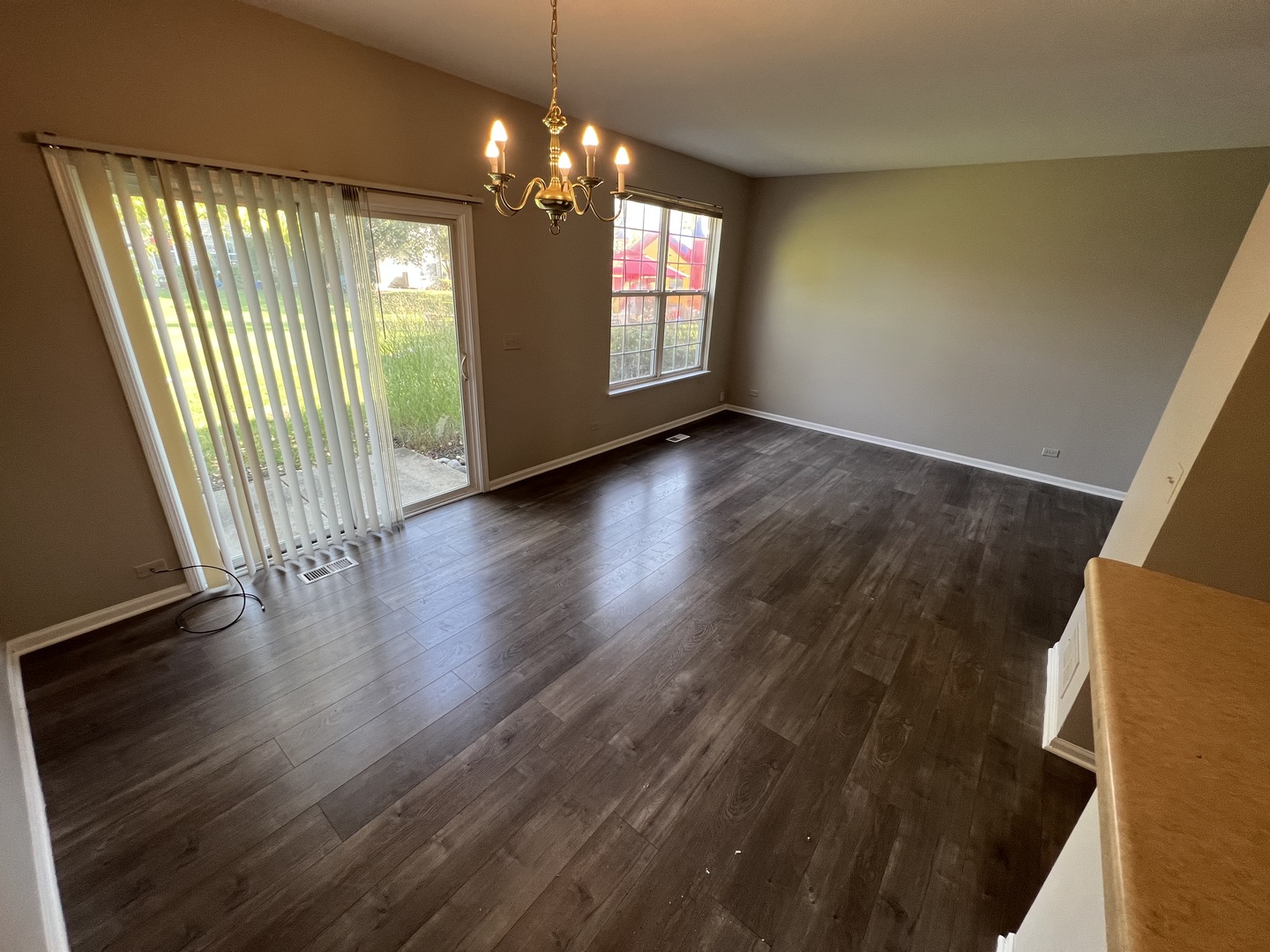 3044 Troon Drive Montgomery, IL 60538 - Photo 19 of 20 an empty room with wooden floor and windows