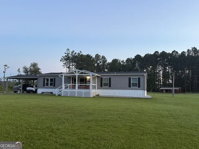 a view of a house with a big yard