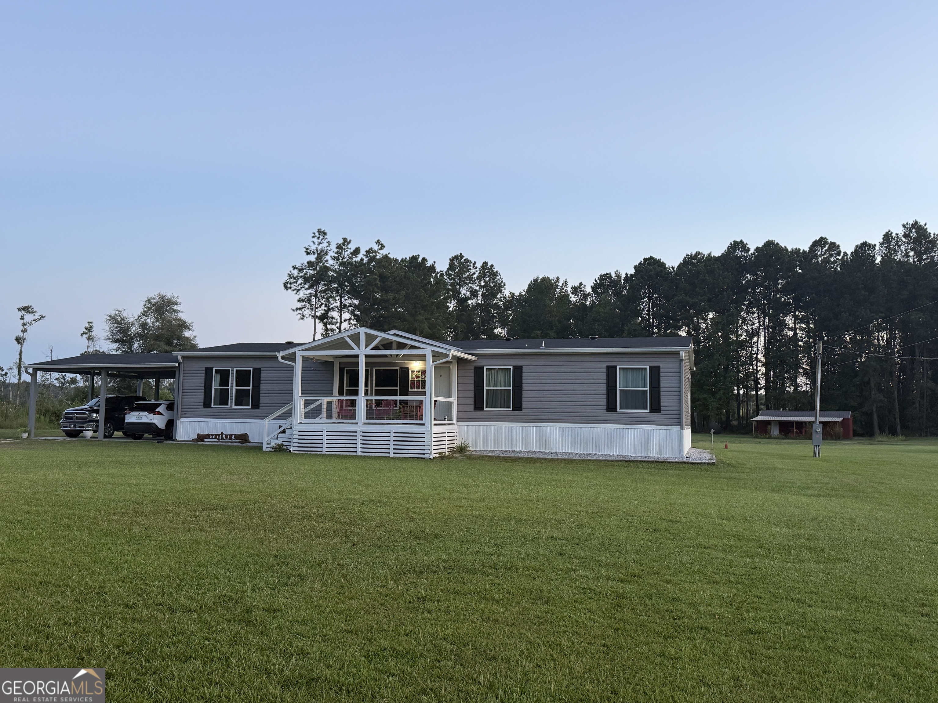 a view of a house with a big yard