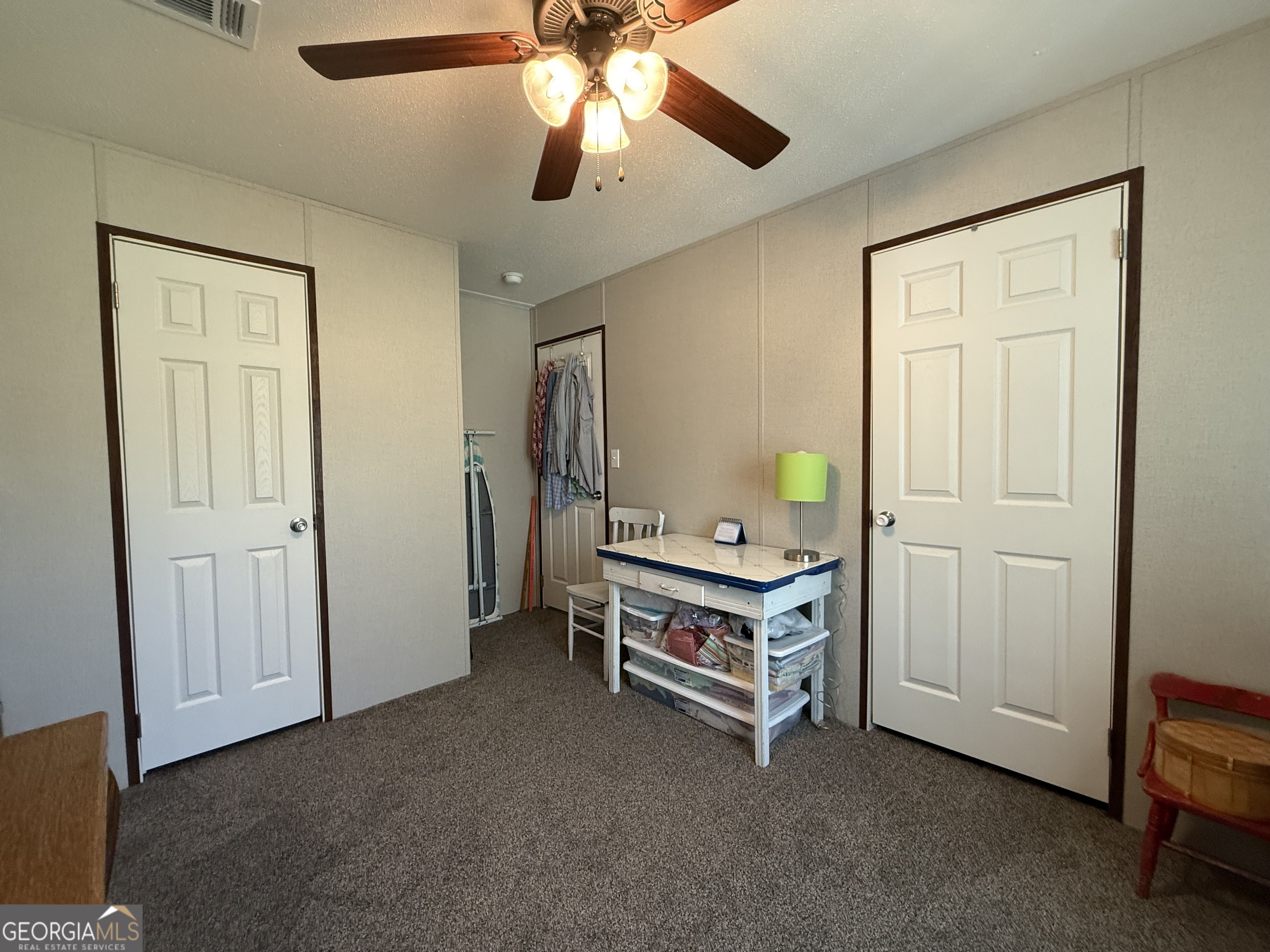 1430 Old Poor Robin Road Sylvania, GA 30467 - Photo 12 of 30 a view of a livingroom with furniture and chandelier fan